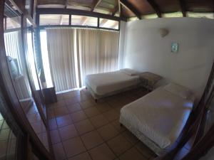 Tempat tidur dalam kamar di Ocotal Beach Front House #25