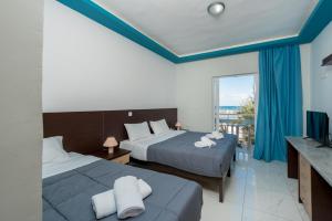 Voodi või voodid majutusasutuse Callinica Hotel toas