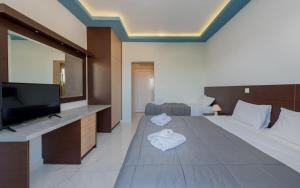 Voodi või voodid majutusasutuse Callinica Hotel toas
