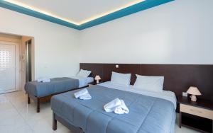 Voodi või voodid majutusasutuse Callinica Hotel toas