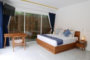 Postel nebo postele na pokoji v ubytování Seri Resort Gili Meno - Adults Only