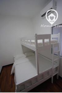 a white bunk bed in a room at AMAZING SEAVIEW @ SILVERSCAPE in Melaka