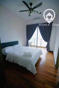 a bedroom with a bed and a ceiling fan at AMAZING SEAVIEW @ SILVERSCAPE in Melaka