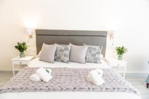 Postel nebo postele na pokoji v ubytování Whalesong Hotel & Spa