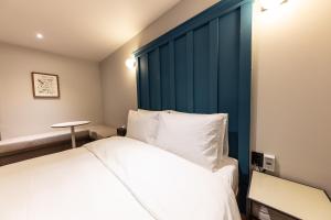 Postel nebo postele na pokoji v ubytování Brown Dot Hotel Seong Seo