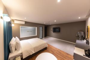 Postel nebo postele na pokoji v ubytování Brown Dot Hotel Seong Seo