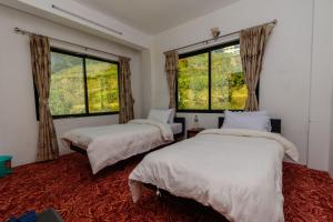 Postel nebo postele na pokoji v ubytování Nayagaun Village Resort + 30 fotografií