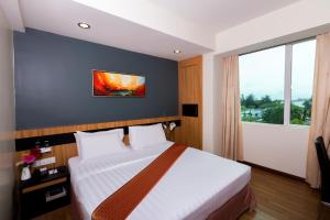 Postelja oz. postelje v sobi nastanitve Mariner Hotel Labuan