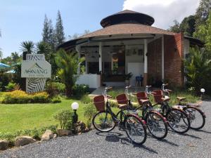 a group of bikes parked in front of a building at Aonang Eco Villa - SHA Extra Plus in Ao Nang Beach