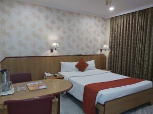 Voodi või voodid majutusasutuse Hotel Nataraj toas