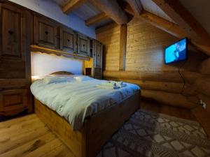 Postel nebo postele na pokoji v ubytování Chalet le Dorf