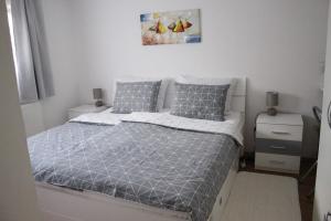 Postel nebo postele na pokoji v ubytování Apartman TIM + 21 fotografií