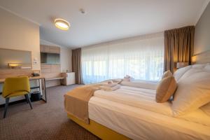 Ένα ή περισσότερα κρεβάτια σε δωμάτιο στο Hotel Soni Lux