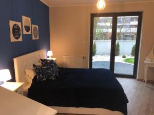 Posteľ alebo postele v izbe v ubytovaní Wislane Tarasy 2.0 by Atrium Apartments