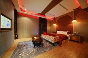 Säng eller sängar i ett rum på Hua Mu Lan Hotel