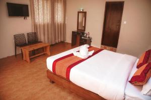 Łóżko lub łóżka w pokoju w obiekcie Hotel Himalayan Vacation