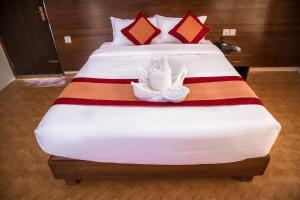 Łóżko lub łóżka w pokoju w obiekcie Hotel Himalayan Vacation