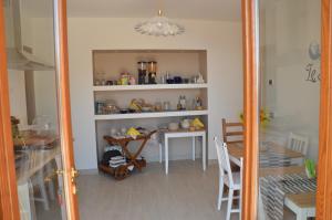 a dining room with a table and a mirror at B&B LE TRE FATE in Varazze +12 photos