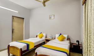 Postel nebo postele na pokoji v ubytování Itsy Hotels Shree Comforts