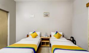 Postel nebo postele na pokoji v ubytování Itsy Hotels Shree Comforts