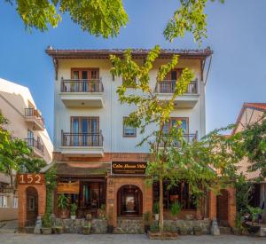 a building with a store in front of it at Calm House Hotel Hoi An 1 in Hoi An