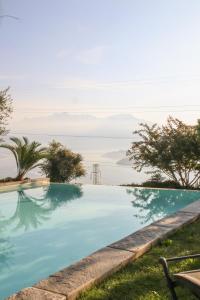 a swimming pool with a view of the ocean at Agriturismo Treterre in Pianello Del Lario