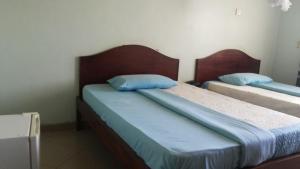 מיטה או מיטות בחדר ב-DaysInn Hotel