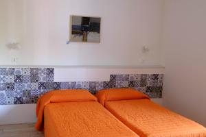 Säng eller sängar i ett rum på Campeggio Villaggio San Giorgio Vacanze