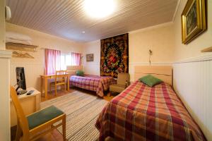 Ένα ή περισσότερα κρεβάτια σε δωμάτιο στο Mäntylän Tila