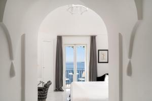 a white living room with a view of the ocean at Hotel Villa Franca in Positano