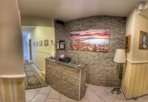 a lobby with a counter and a painting on the wall at B&B 248 in Naples