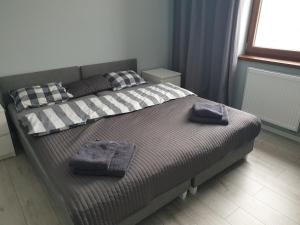 Posteľ alebo postele v izbe v ubytovaní Apartament SONIA