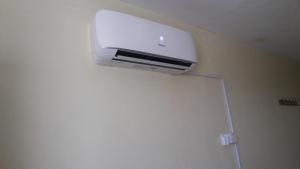 a air conditioner on the ceiling of a room at Palema Crown Hotel in Gulu