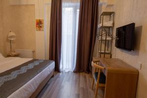 TV a/nebo společenská místnost v ubytování Ornament Boutique Hotel