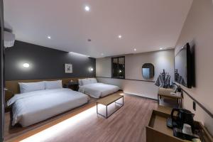 Postel nebo postele na pokoji v ubytování Brown Dot Hotel Seong Seo