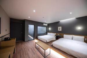 Postel nebo postele na pokoji v ubytování Brown Dot Hotel Seong Seo