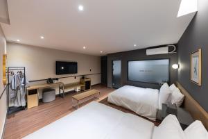 Postel nebo postele na pokoji v ubytování Brown Dot Hotel Seong Seo