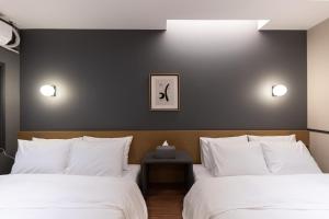 Postel nebo postele na pokoji v ubytování Brown Dot Hotel Seong Seo
