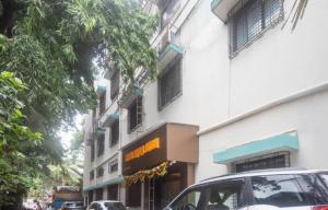 a car parked in front of a building at Hotel Durga Elite Mumbai in Mumbai