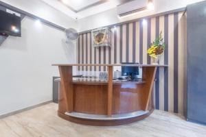 TV a/nebo společenská místnost v ubytování Hotel Durga Elite Mumbai + 18 fotografií