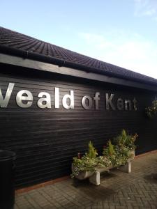 a sign on the side of a building at Weald of Kent Golf Course and Hotel in Headcorn