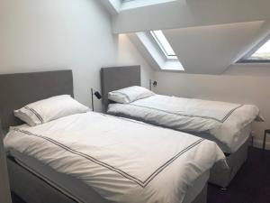 Un pat sau paturi într-o cameră la 3, The Links