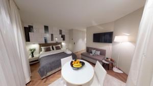 a bedroom with a bed and a table with bananas on it at VISIONAPARTMENTS Bellariastrasse - self check-in in Zurich