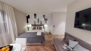 a bedroom with a bed and a living room at VISIONAPARTMENTS Bellariastrasse - self check-in in Zurich +33 photos