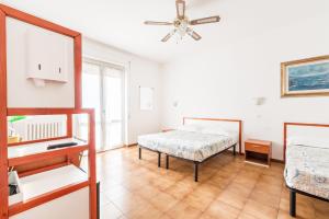 Łóżko lub łóżka w pokoju w obiekcie Lia Rooms 4