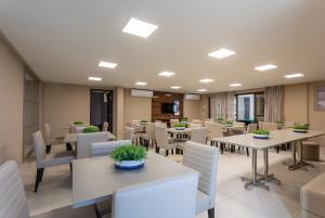 Khu vực ghế ngồi tại Apartamento NOVO - Beira mar de Intermares