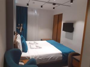 Letto o letti in una camera di R&R Hotel