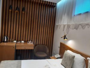 Letto o letti in una camera di R&R Hotel