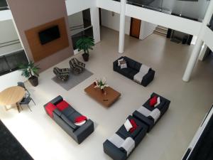 an overhead view of a living room with couches at Guines Palace Hotel in Patrocínio
