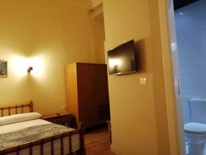 Katil atau katil-katil dalam bilik di Tulip Hotel